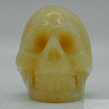 Orange Calcite Human Skull